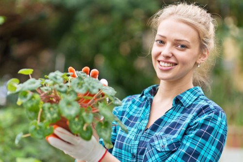 Professionals performing garden clearance in a lush Chingford garden